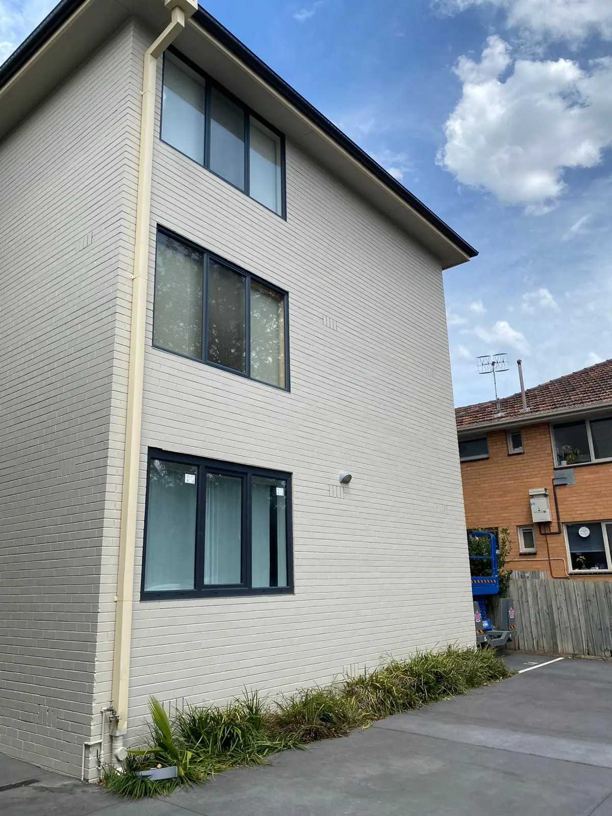 Completed painted brick elevation at 21 Irving Avenue