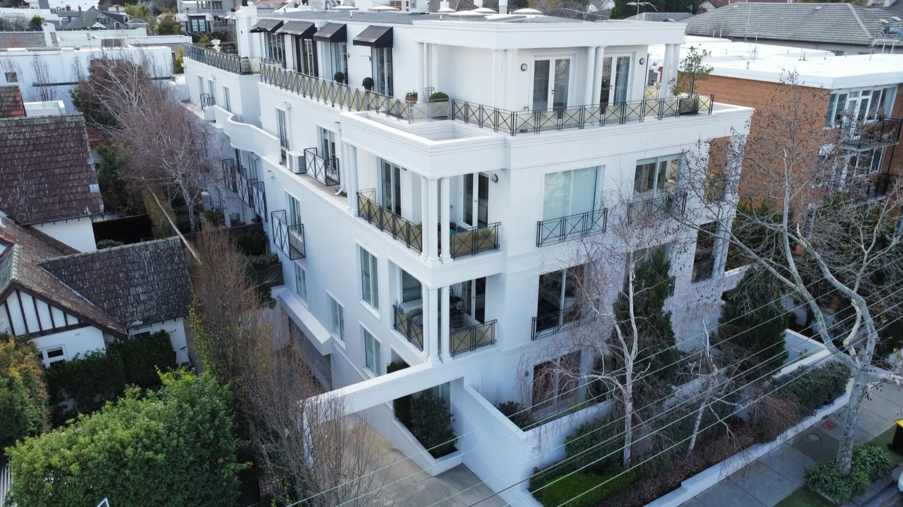 Completed exterior painting and render repairs at 391 Toorak Road, South Yarra