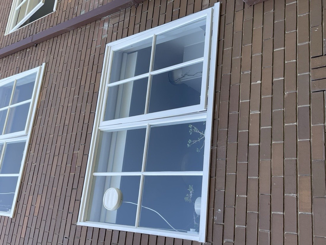 Completed replacement windows on a Melbourne brick apartment building